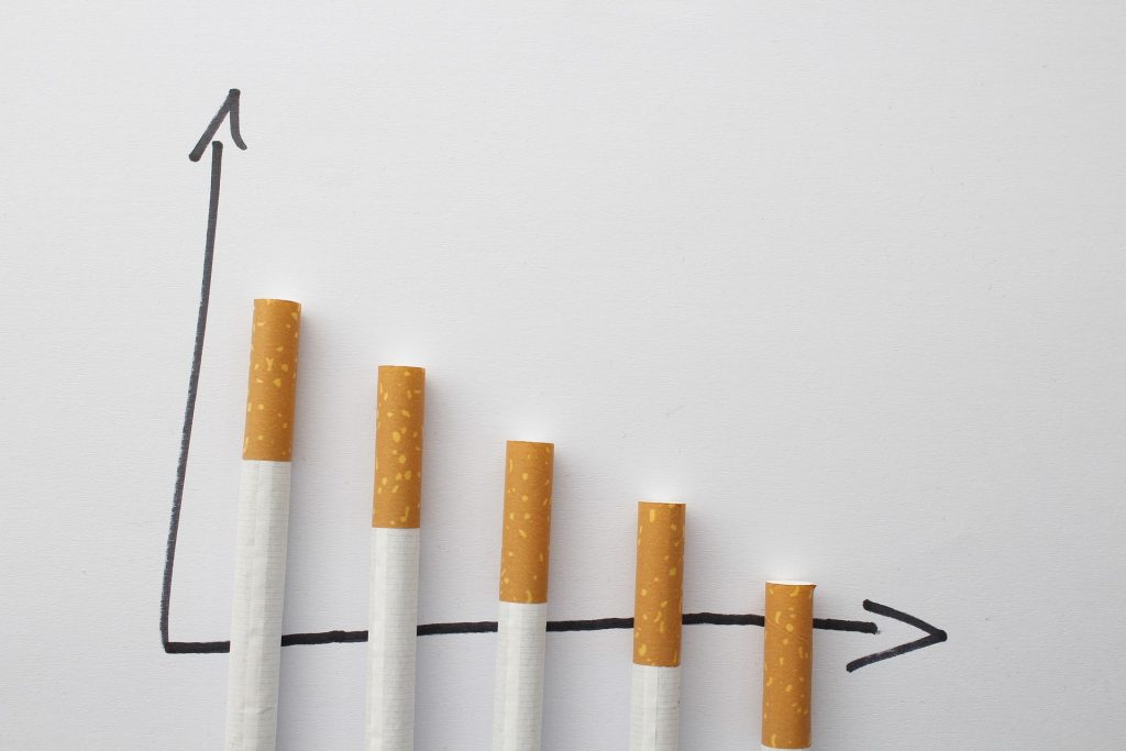 A hand drawn graph uses cigarettes as bars to show a decrease over time